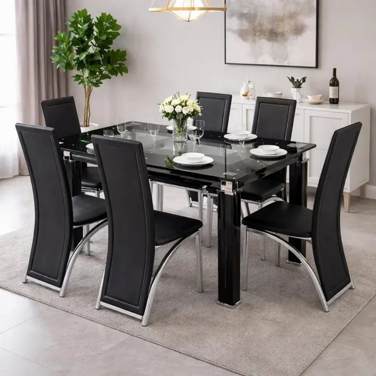 Black glass dining table with six sleek black upholstered chairs in modern room