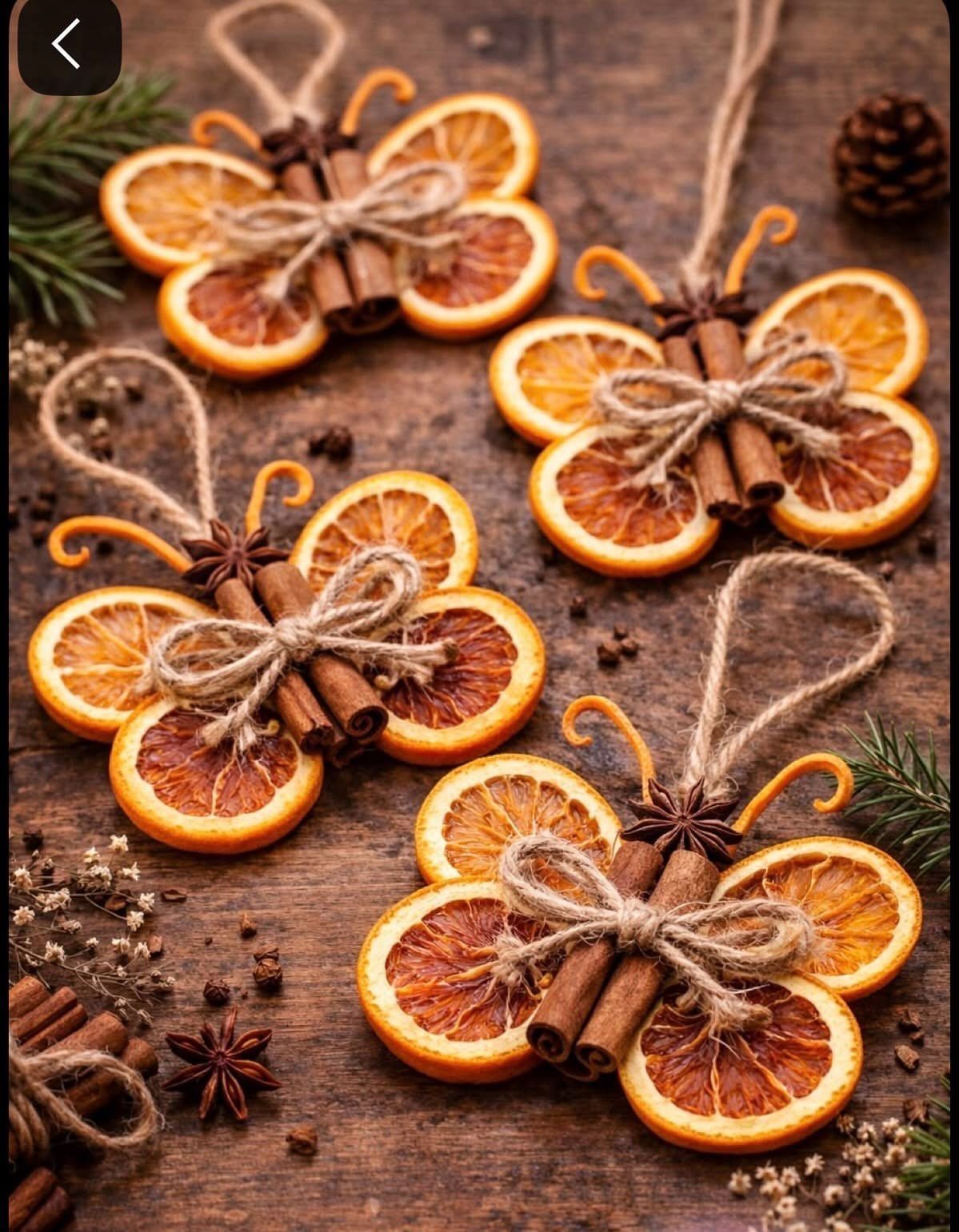Dried orange slices and cinnamon sticks tied with twine as Christmas ornaments.