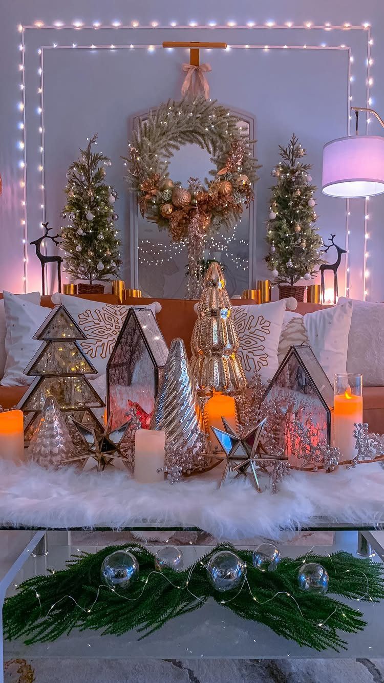 Christmas coffee table decorations with gold trees, candles, and white faux fur runner