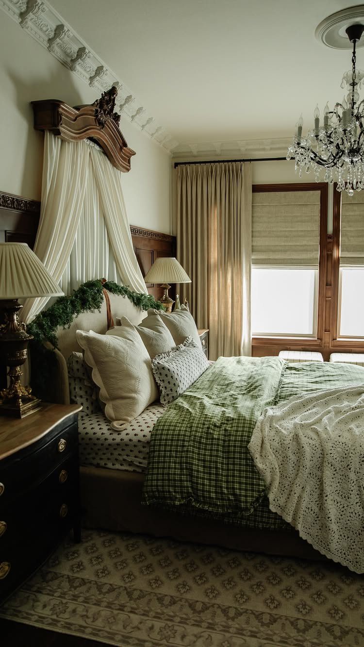 Bed with green checkered bedding and a festive garland draped over the headboard.