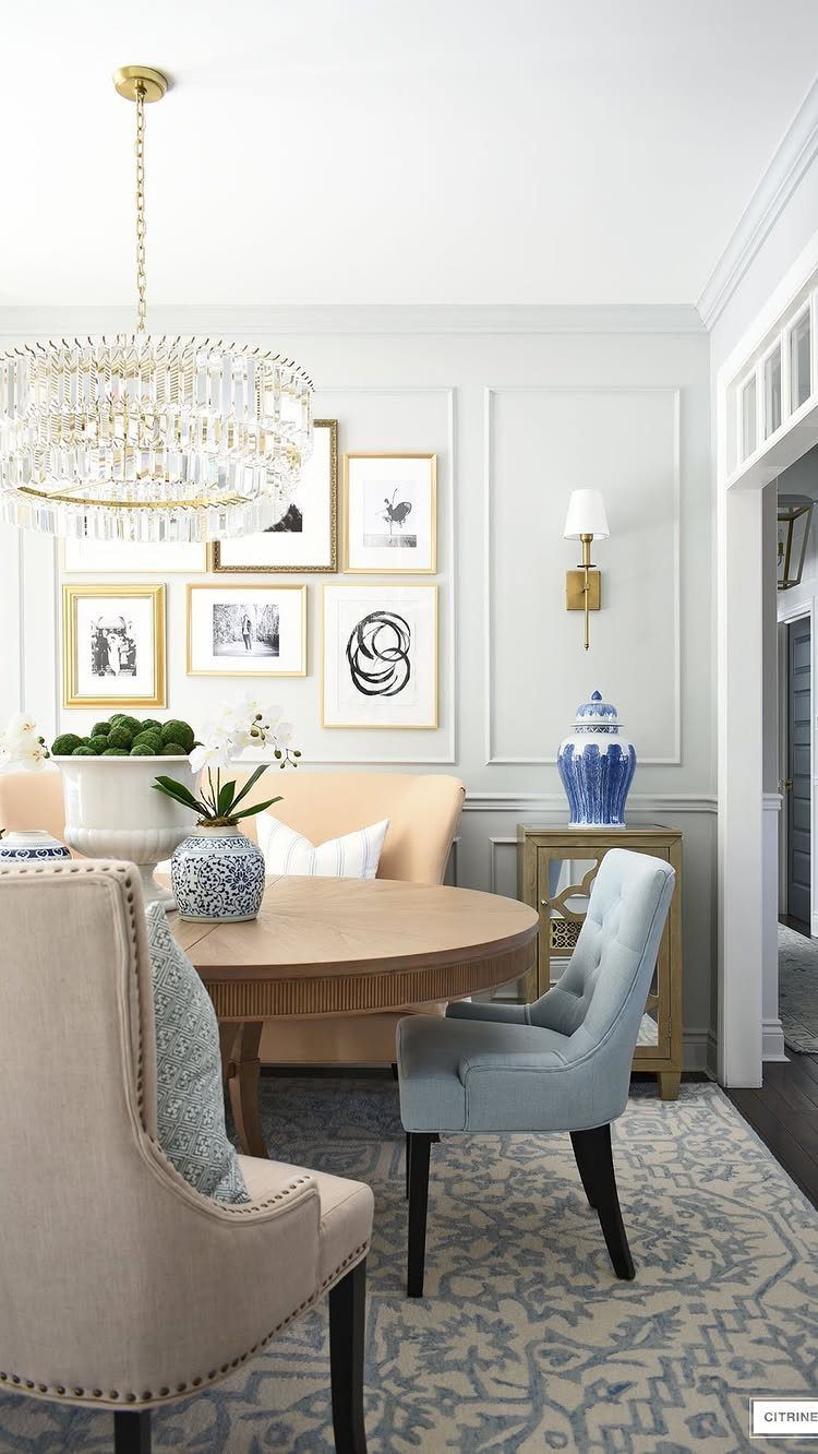 Light gray dining room with matching gray walls and trim, featuring picture frame molding.