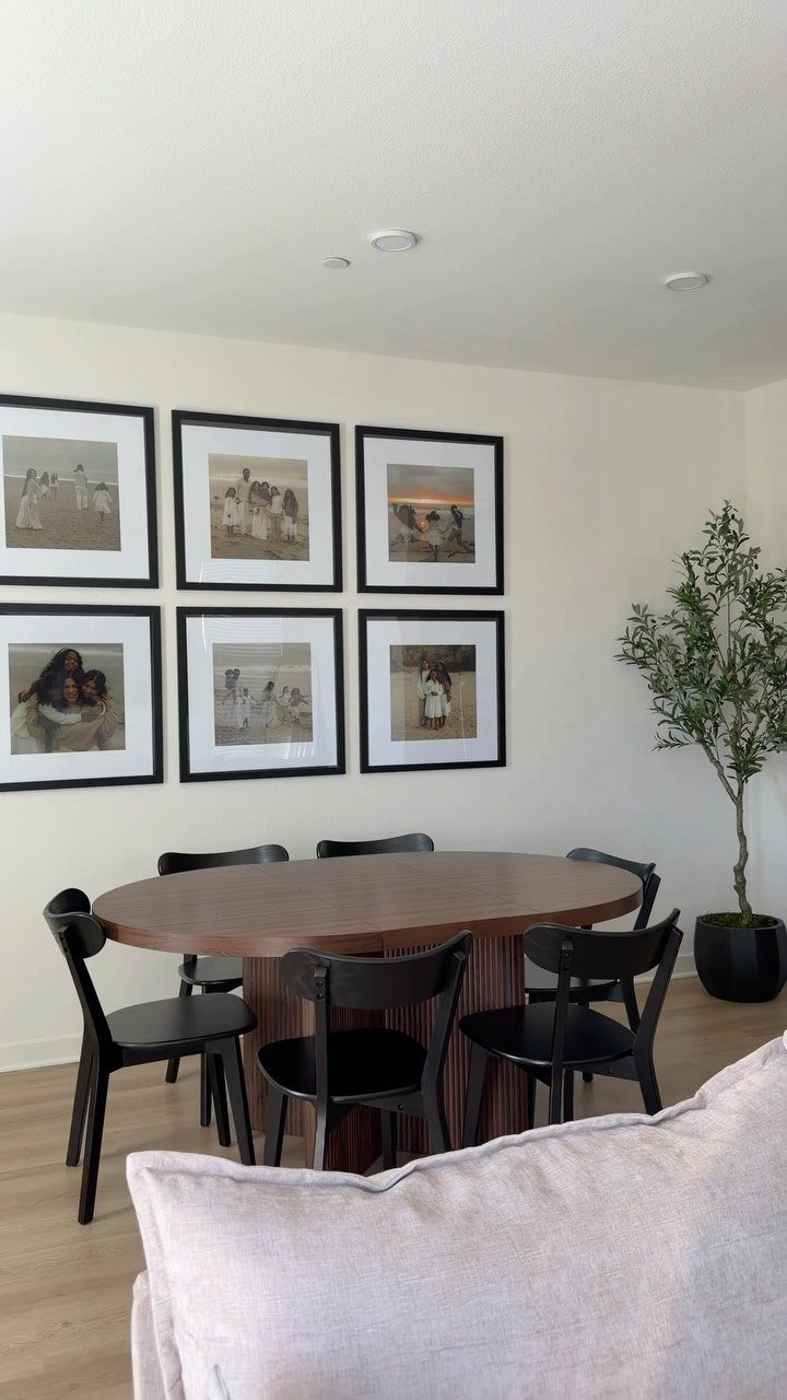Six black-framed photos arranged in a grid layout above a dining table.