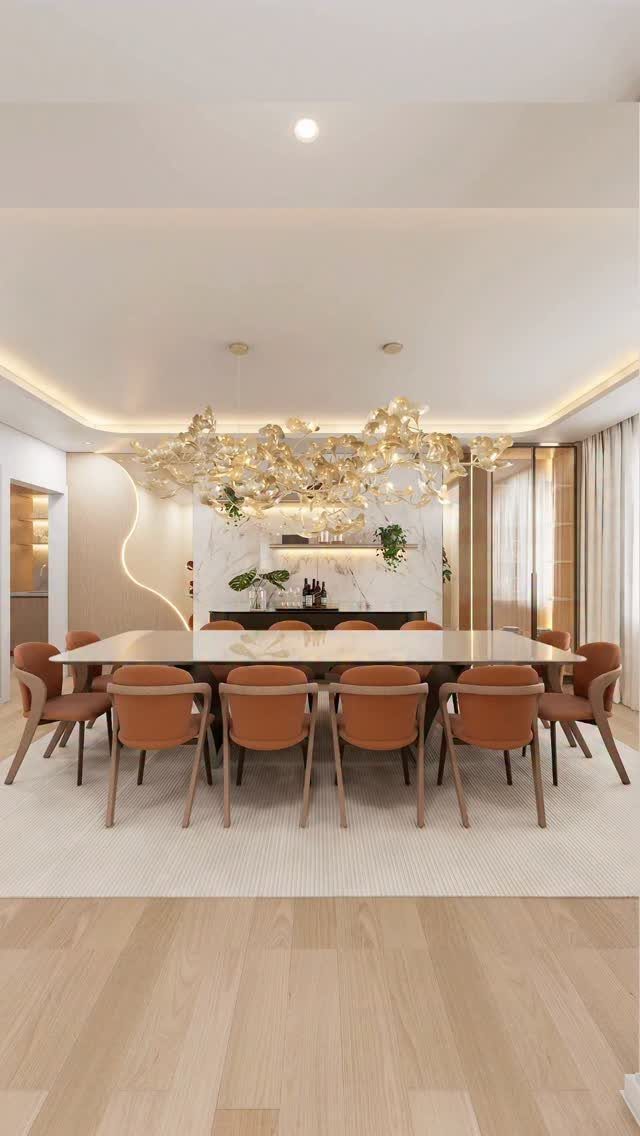 Modern dining room with a white table, brown chairs, and a dark buffet cabinet.
