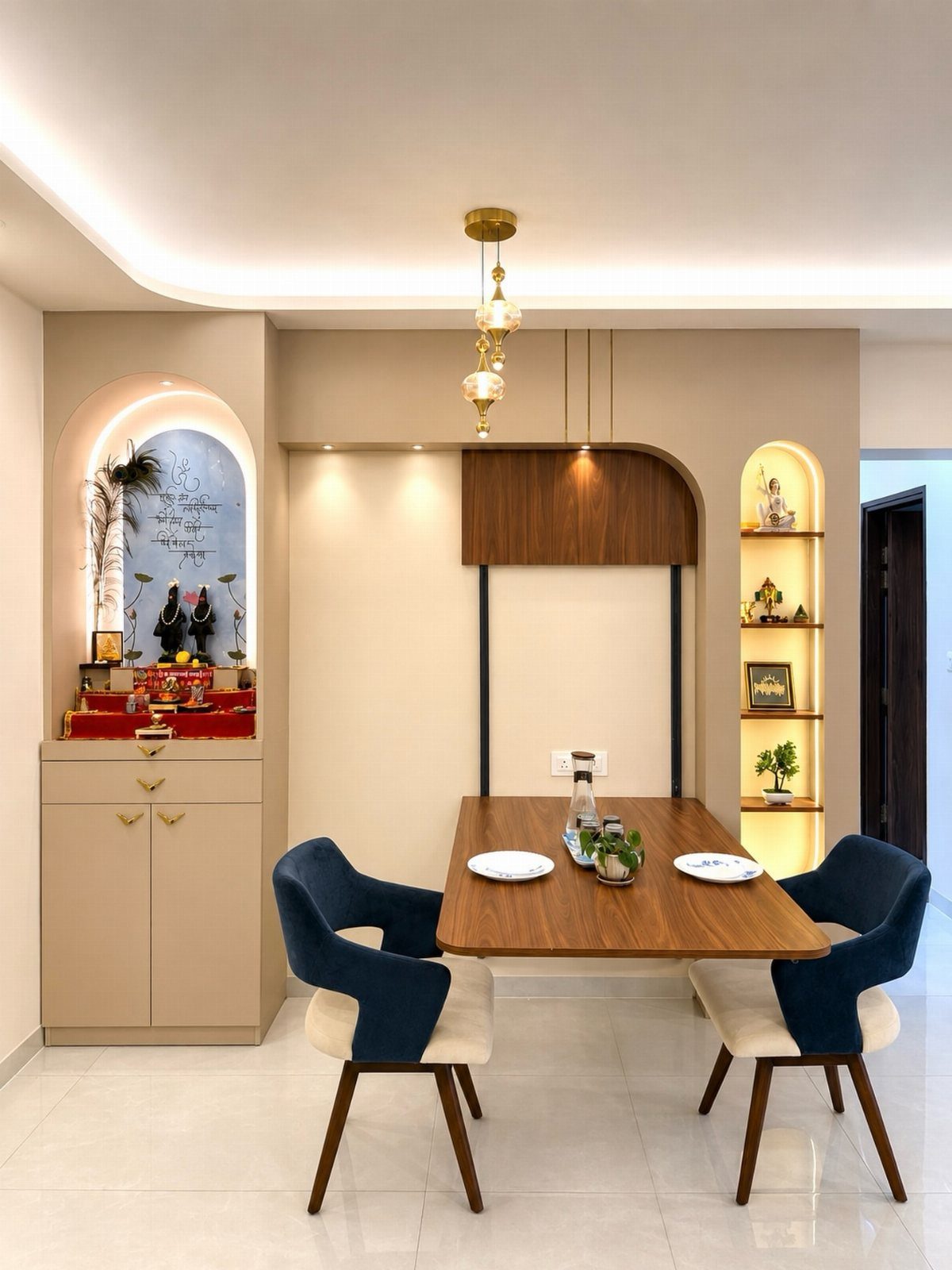 Wooden dining table with two blue chairs in a modern neutral interior