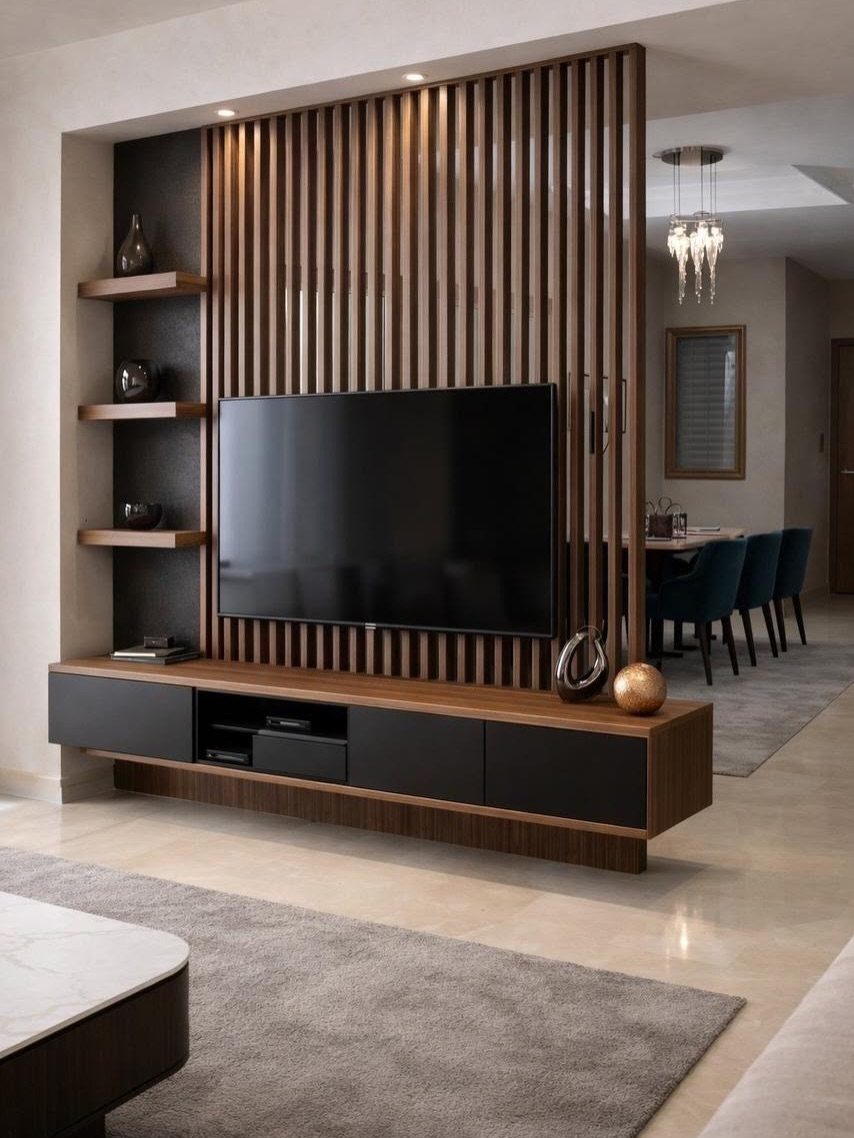 Wall-mounted television with a wooden slat room divider and floating media console.