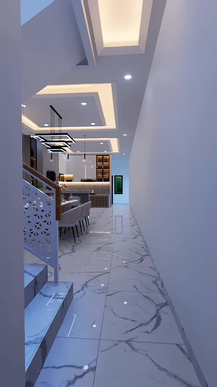 Modern open concept dining area with white marble floors and recessed ceiling lighting