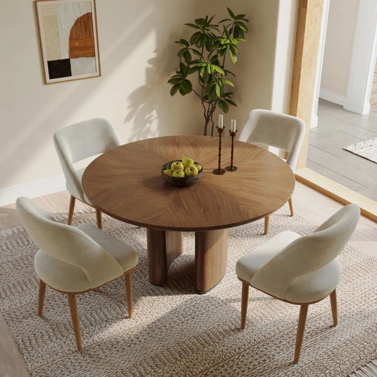 Round wooden dining table with sculptural pedestal base and cream upholstered chairs