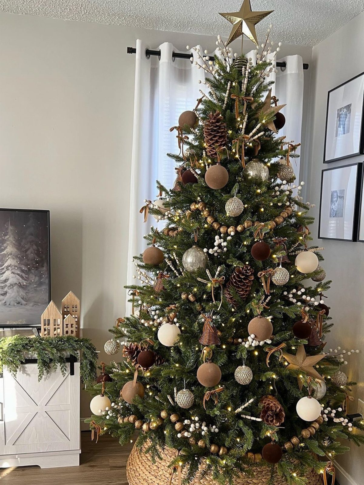 Decorated Christmas tree with neutral ornaments and wood beads in a bright room