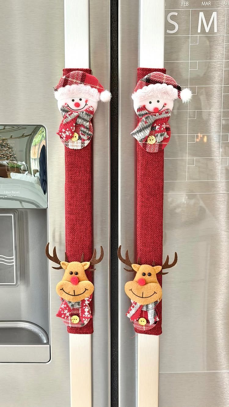 White ice skates decorated with red fabric and plush Christmas characters on a refrigerator.