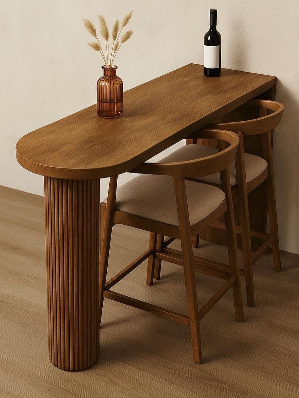 Narrow wooden table with fluted leg and two chairs against a plain wall