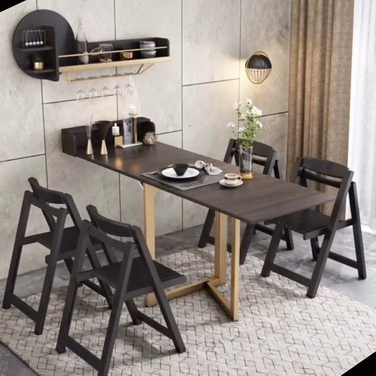Dark wood dining table and folding chairs on a geometric rug in minimalist room