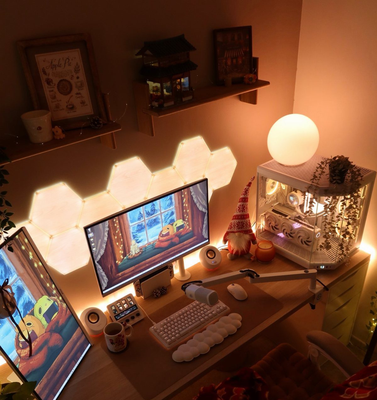 Cozy desk setup with warm lighting, hexagonal wall panels, and a Christmas gnome.